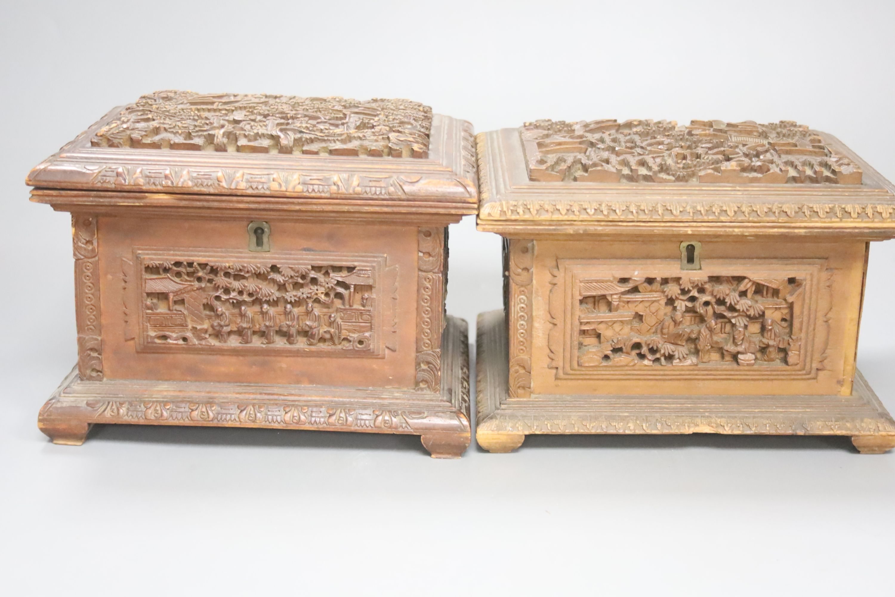 Three Chinese carved hardwood caskets, largest 19 x 15cm 13cm high